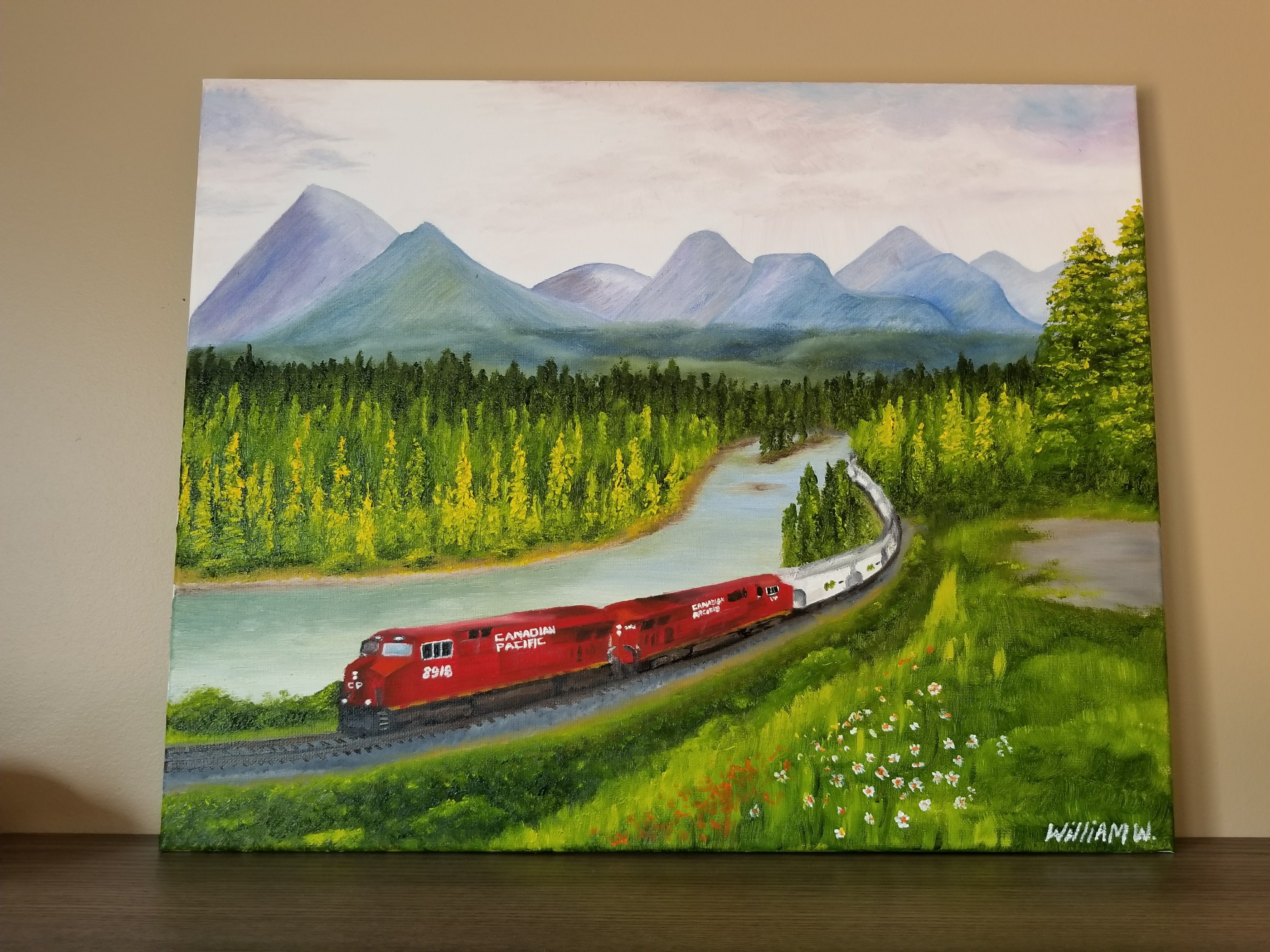 Freight train in the Rocky Mountains (oil painting)